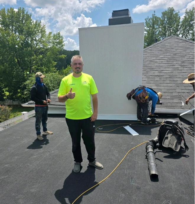 Jonathan Stephenson and the All Done crew on a finished flat roof in Memphis, Tennessee