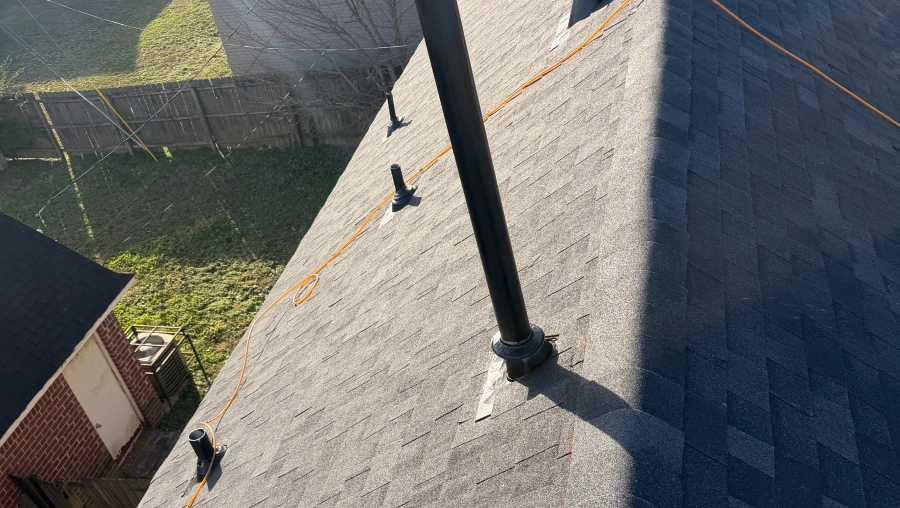 Freshly installed shingle courses with snapped chalk lines on a roof in Germantown, Tennessee